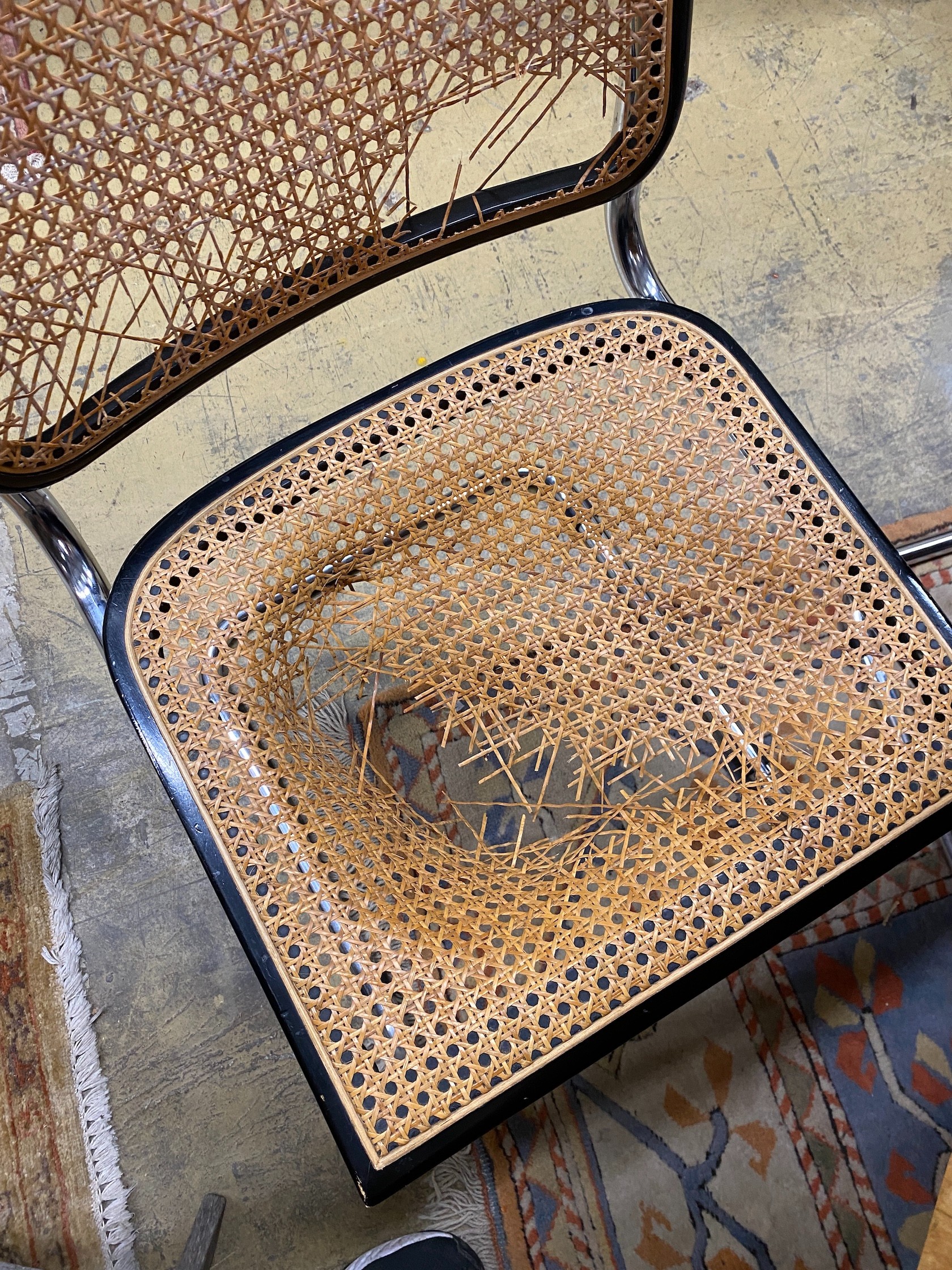 Six caned ebonized cantilever dining chairs in the style of Knoll Cesca by Marcel Breuer